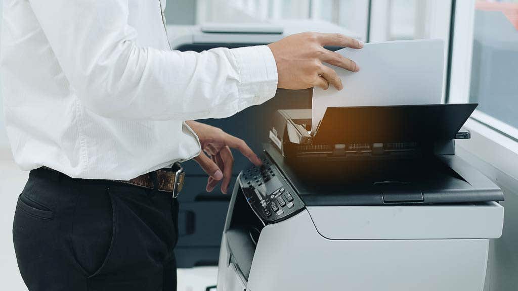 Man using an office printer