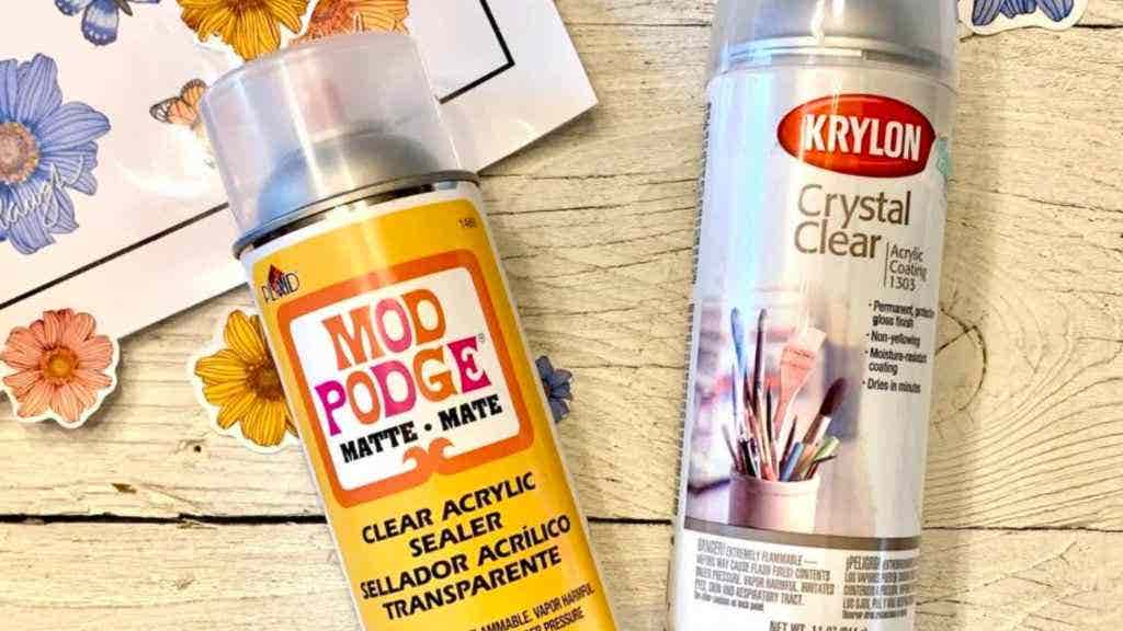 Two cans of clear acrylic spray